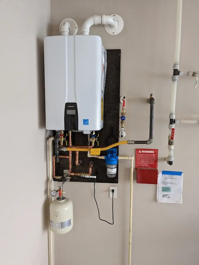 Professional plumber installing copper piping in a Rainbow Springs home